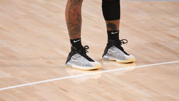 Grey and black Yeezy basketball shoes.